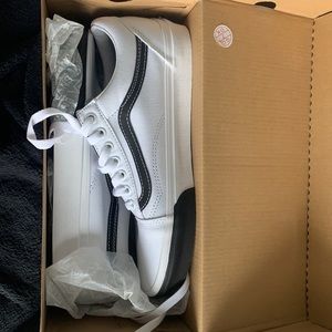 Brand new white and black vans.